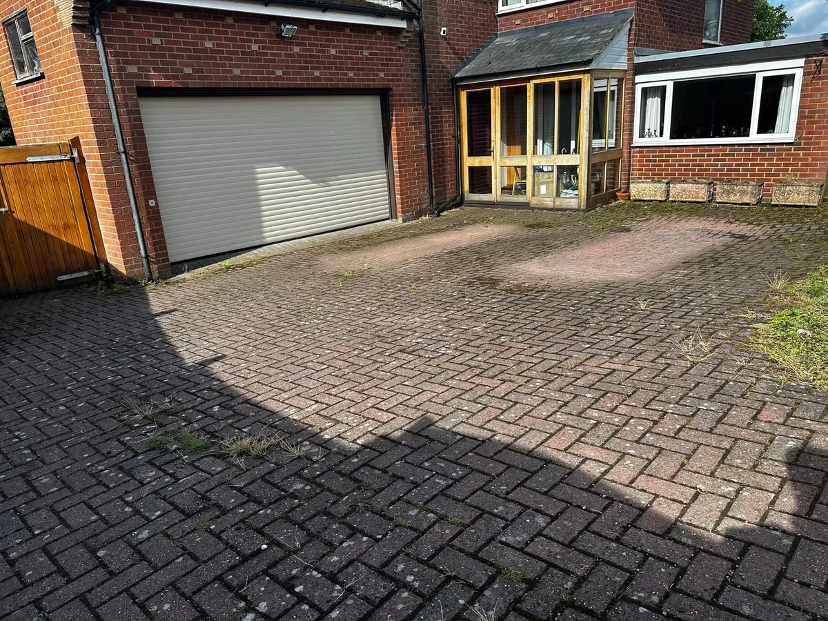 Dirty block paving driveway before pressure washing in Crewe